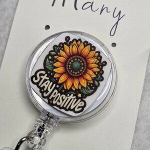 Badge reel with handmade charm accessory